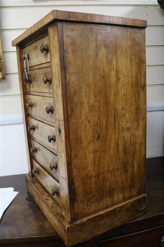 A Victorian cross-banded walnut Wellington chest of small proportions, fitted six drawers, (top a.f.) H.60cm